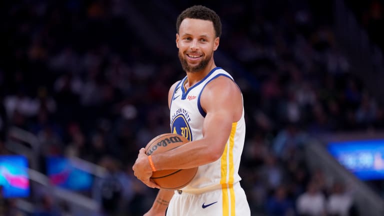 Stephen Curry Signs Shoes for Fans After Warriors Game